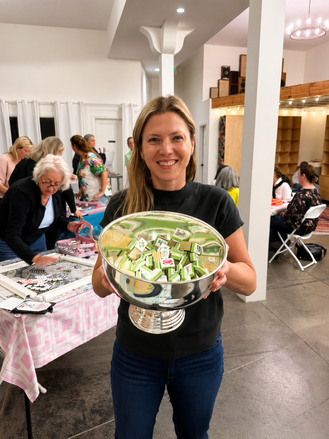 Reba Rosenthal holding the LA LA Mahjong Spring Championship bowl